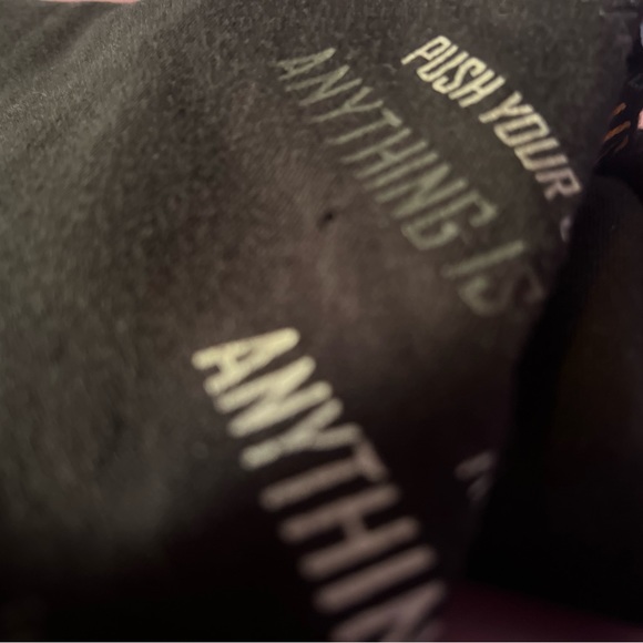 Small black t shirt with writing on the front. - Picture 2 of 4